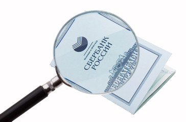 passbook enlarged with a magnifying glass