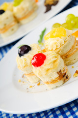 Plate full of tasty mini cakes