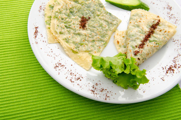 Pancake with herbs in the plate
