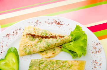 Pancake with herbs in the plate