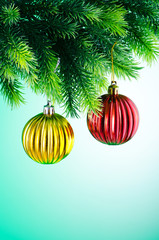 Baubles on christmas tree in celebration concept