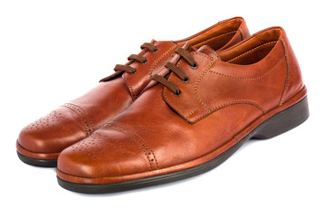 The brown elegant men's shoes on the white isolated background