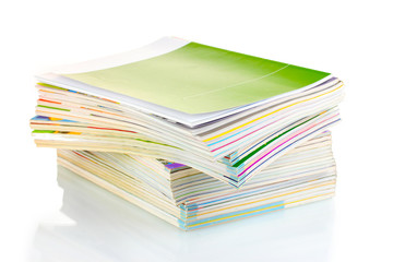 Stack of magazines isolated on white