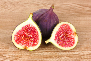 Ripe figs on wooden background