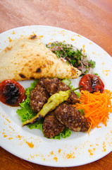 Meat cuisine - kebab served in plate