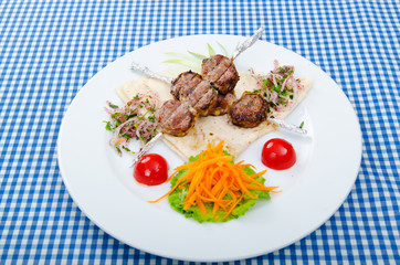 Meat cuisine - kebab served in plate