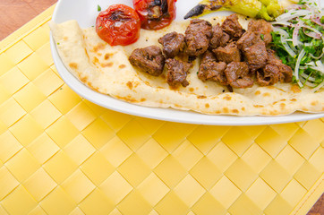 Kebab served in the plate
