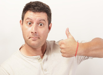 Image of a man showing a thumbs up gesture