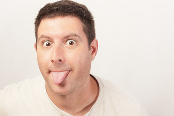 Image of a man sticking out his tongue