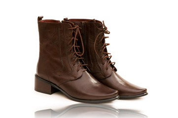 Fashion concept with boots on white