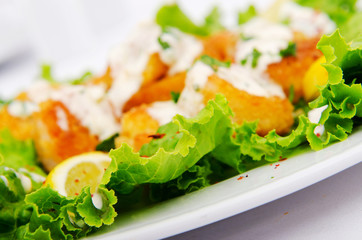 Ceasar salad served in the plate