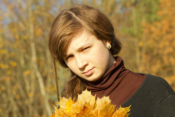 teen girl in autumn park