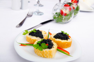 Black caviar served on bread