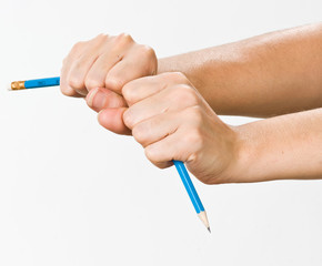 hand with broken pencil