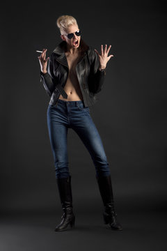 Rocker lady with sunglasses and cigarette yelling