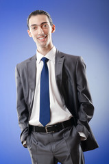 Fototapeta premium Young businessman in studio shooting