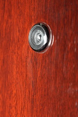 Peephole on wooden door