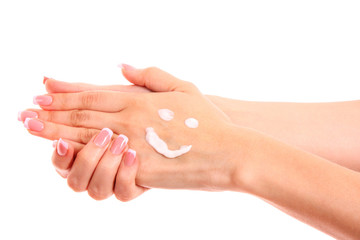 Fototapeta premium Closeup of beautiful female hands applying hand cream