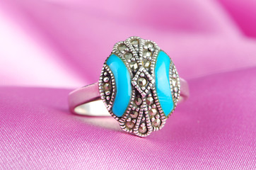 Fashion concept with ring on background