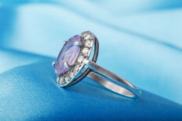 Jewellery ring on the satin background