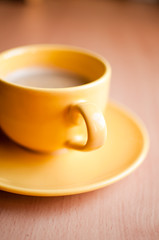 Coffee in an yellow cup