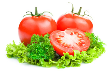 Red Ripe Tomatoes with cut and lettuce, parsley  on White backgr