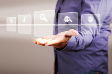 Hand touching screen with buttons on it