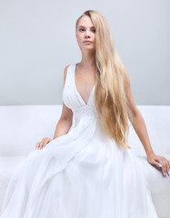 Portrait of the beautiful girl in a wedding dress