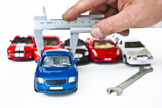 Five cars and hands with measure