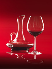 glass of red wine and pitcher