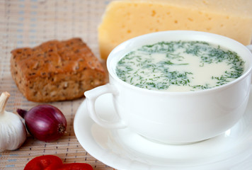 Cheese soup with dill and cereal bread