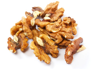 Crushed walnuts on white background