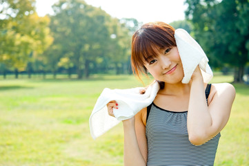 beautiful asian woman relaxing in the park