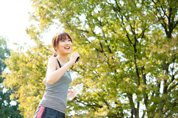 beautiful asian runnning in the park