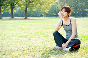 beautiful asian woman relaxing in the park