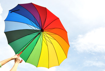 Rainbow umbrella in the hands - 36229770