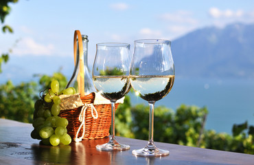 Wine and grapes against Geneva lake. Lavaux region, Switzerland
