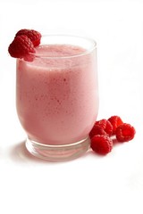 raspberries mixed with yoghurt as tasty cocktail