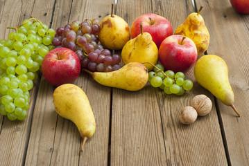 apples grapes and pears, wooden table