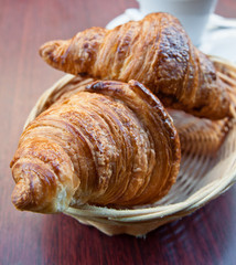 Breakfast with coffee and croissants