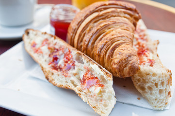 Breakfast with coffee and croissants