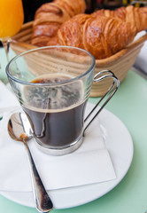 Breakfast with coffee and croissants