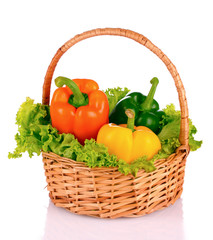 vegetables in a basket isolated on white