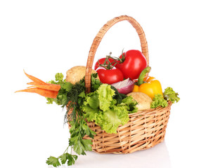 vegetables in a basket isolated on white