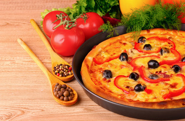 pizza and vegetables on a red background