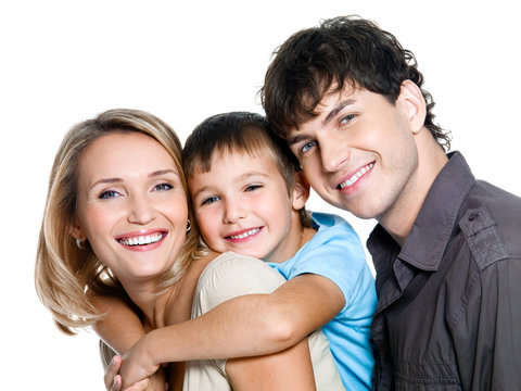 Portrait of happy young smiling family with child
