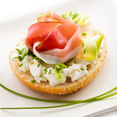 Breadroll with cream cheese and smoked bacon