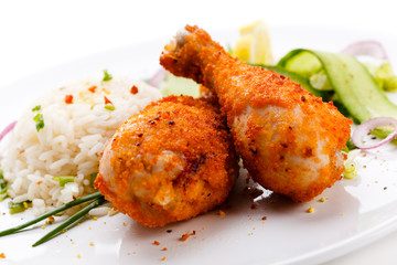 Roasted chicken drumsticks, rice and vegetables