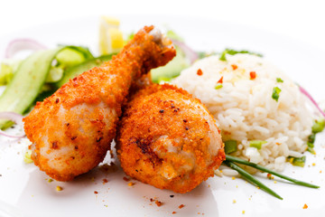 Roasted chicken drumsticks, rice and vegetables