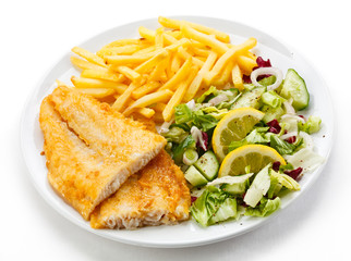 Fish dish - fried fish fillet, French fries with vegetables